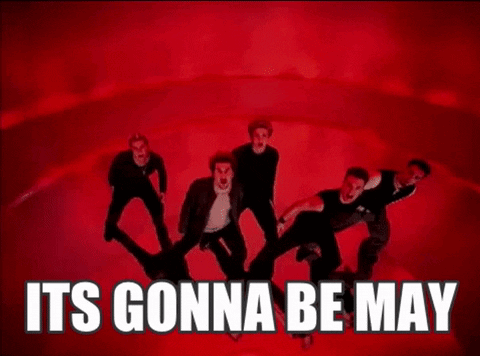 A Man In A Black Shirt Is Dancing In Front Of A Red Background . GIF