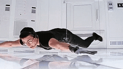 A Man In A Black Shirt Is Flying Through The Air . GIF