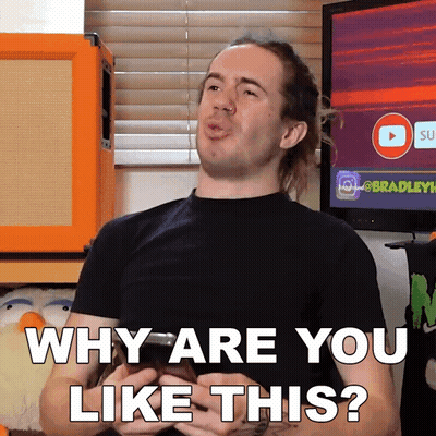 A Man In A Black Shirt Is Holding A Cell Phone And Says Why Are You Like This GIF