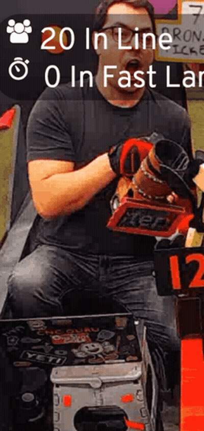 A Man In A Black Shirt Is Holding A Tool And A Sign That Says ' 20 In Line 0 In Fast Lane ' GIF