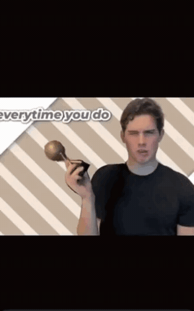 A Man In A Black Shirt Is Holding A Trophy In Front Of A Striped Background That Says " Everytime You Do " GIF
