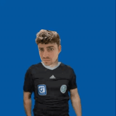 A Man In A Black Shirt Is Holding Up An Orange Card GIF