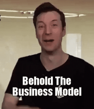 A Man In A Black Shirt Is Making A Funny Face And Saying Behold The Business Model . GIF
