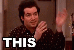 A Man In A Black Shirt Is Making A Funny Face And Says `` This '' . GIF