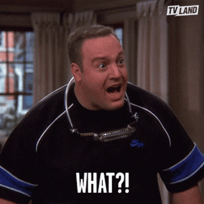 A Man In A Black Shirt Is Making A Funny Face And Says What GIF