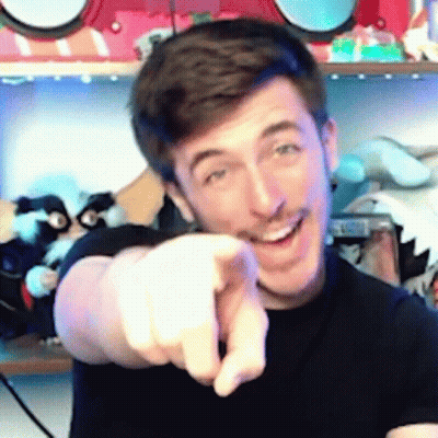 A Man In A Black Shirt Is Pointing His Finger At The Camera . GIF