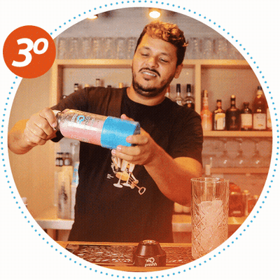 A Man In A Black Shirt Is Pouring A Drink Into A Glass With A 30 Circle Around Him GIF