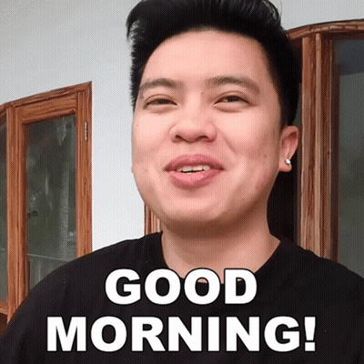 A Man In A Black Shirt Is Smiling And Says Good Morning GIF