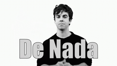 A Man In A Black Shirt Is Smiling In Front Of A White Background With The Words De Nada Written On It . GIF