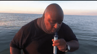 Man In Black Shirt Smoking In Water GIF