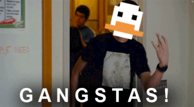 A Man In A Black Shirt Is Standing In Front Of A Door That Says Gangstas On It GIF