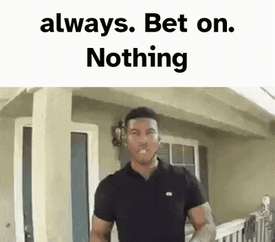 A Man In A Black Shirt Is Standing In Front Of A House With The Words `` Always Bet On Nothing '' Above Him . GIF