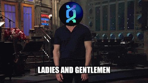A Man In A Black Shirt Is Standing In Front Of A Ladies And Gentlemen Sign GIF