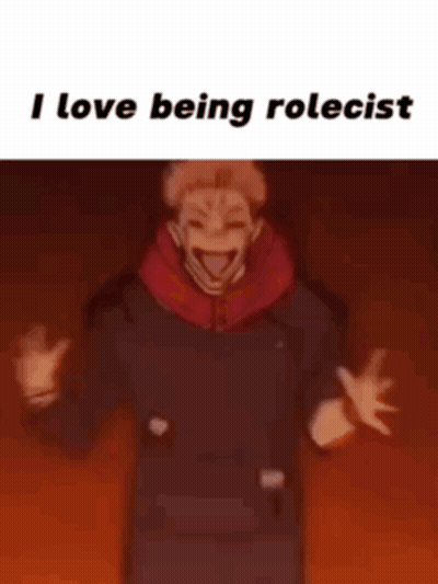 A Man In A Black Shirt Is Standing In Front Of A Red Background With The Words `` I Love Being Rolecast '' . GIF