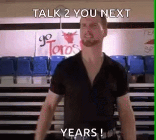 A Man In A Black Shirt Is Standing In Front Of A Sign That Says Go Toro 'S GIF