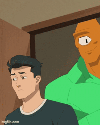 A Man In A Black Shirt Is Standing Next To A Green Man With One Eye GIF