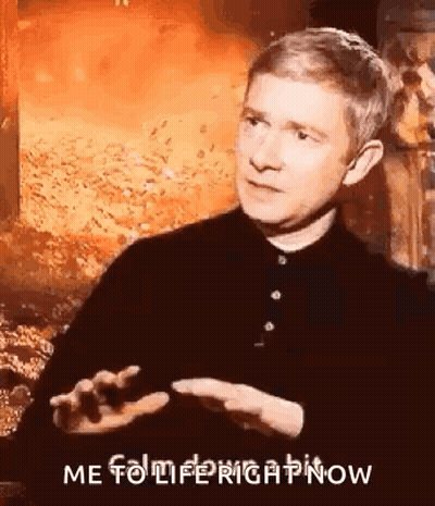 A Man In A Black Shirt Is Talking In Front Of A Fire And Says `` Me To Life Right Now '' . GIF