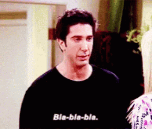 A Man In A Black Shirt Is Talking To A Blonde Woman . GIF