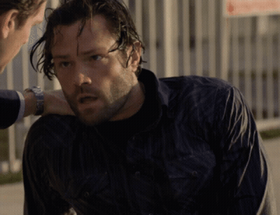 A Man In A Black Shirt Is Talking To Another Man GIF