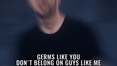 A Man In A Black Shirt Says Germs Like You Don 'T Belong On Guys Like Me In A Dark Room GIF