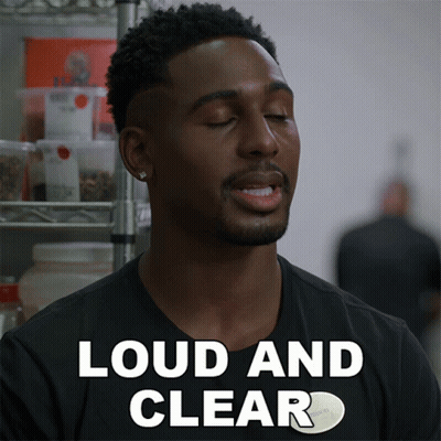 A Man In A Black Shirt Says " Loud And Clear " In White Letters GIF