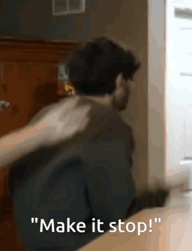 A Man In A Black Shirt Says " Make It Stop " In White Letters GIF