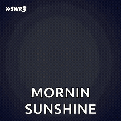 A Man In A Black Shirt Says Mornin Sunshine With His Hands On His Hips GIF