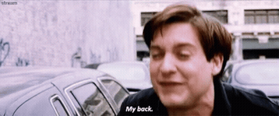 A Man In A Black Shirt Says " My Back " GIF