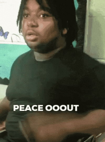 A Man In A Black Shirt Says Peace Ooout With His Hands On His Chest . GIF
