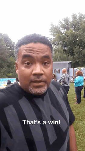 A Man In A Black Shirt Says That 'S A Win In Front Of A Pool GIF