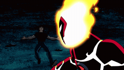 A Man In A Black Shirt Stands In Front Of A Cartoon Character With A Fire Head GIF