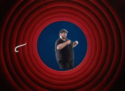 A Man In A Black Shirt Stands In Front Of A Red Circle That Says " That 'S All Folks ! " GIF