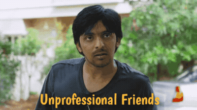 A Man In A Black Shirt Stands In Front Of A Sign That Says " Unprofessional Friends " GIF