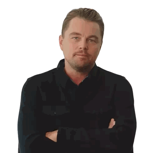 A Man In A Black Shirt With His Arms Crossed Looks At The Camera Sticker