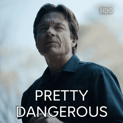 A Man In A Black Shirt With Pretty Dangerous Written On It GIF