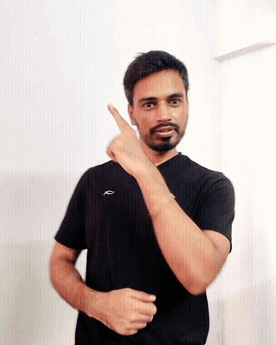 A Man In A Black Shirt With The Letter R On The Front GIF