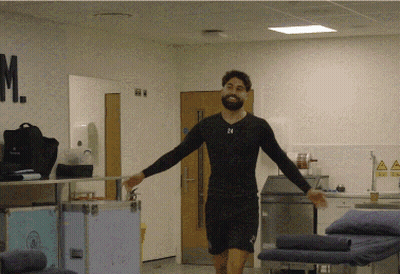 A Man In A Black Shirt With The Number 24 On His Chest GIF