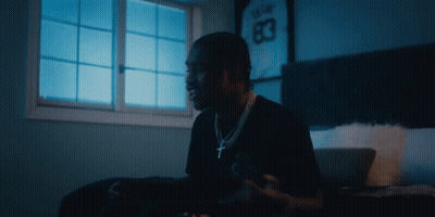 A Man In A Black Shirt With The Number 83 On His Jersey GIF