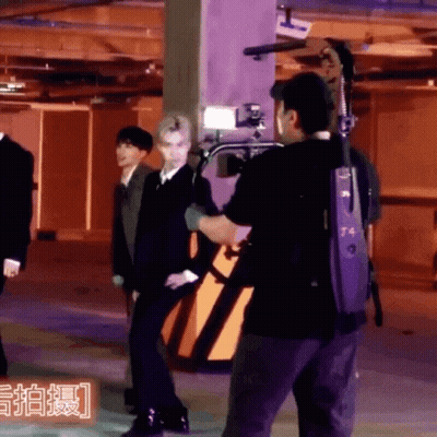 A Man In A Black Shirt With The Number T4 On The Back GIF