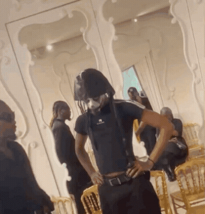 A Man In A Black Shirt With The Word Balenciaga On The Front GIF