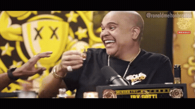 A Man In A Black Shirt With The Word Food On It Laughs GIF