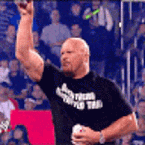 Man In Black Shirt With Team Holding Soda GIF