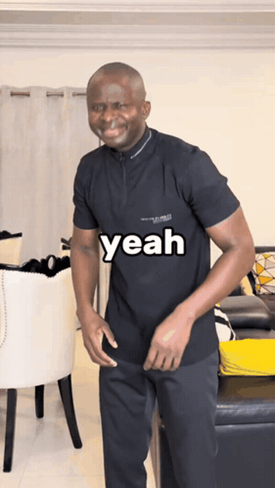 A Man In A Black Shirt With The Word Yeah On It GIF