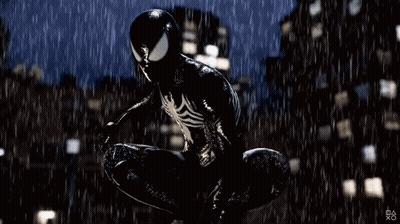 A Man In A Black Spiderman Suit Is Jumping In The Rain . GIF