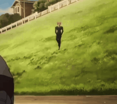 A Man In A Black Suit Is Running Up A Hill GIF