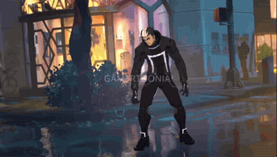 A Man In A Black Suit Is Standing In Front Of A Building That Says Gamertomania GIF