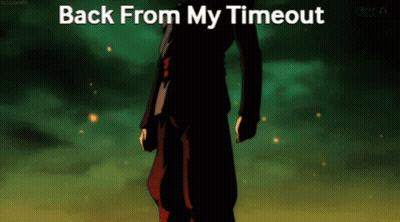 A Man In A Black Suit Is Standing In Front Of A Green Background With The Words Back From My Timeout GIF