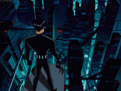 A Man In A Black Suit Stands On A Balcony Overlooking A City At Night GIF