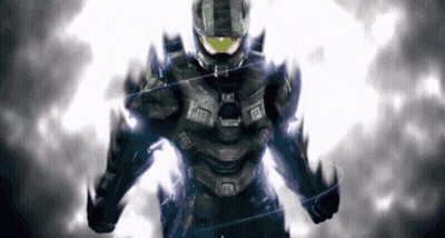 A Man In A Black Suit With A Yellow Helmet Is Standing In Front Of A White Background GIF