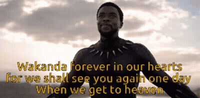 A Man In A Black Suit With The Words Wakanda Forever In Our Hearts GIF